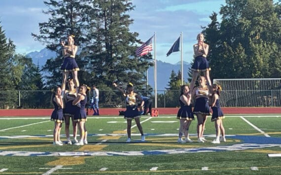 Homer Mariner cheerleaders perform at half time during the game against Kodiak on Friday, Sept. 13, in Homer, Alaska. Varsity defeated Kodiak 58 to 6. (Emilie Springer/ Homer News)