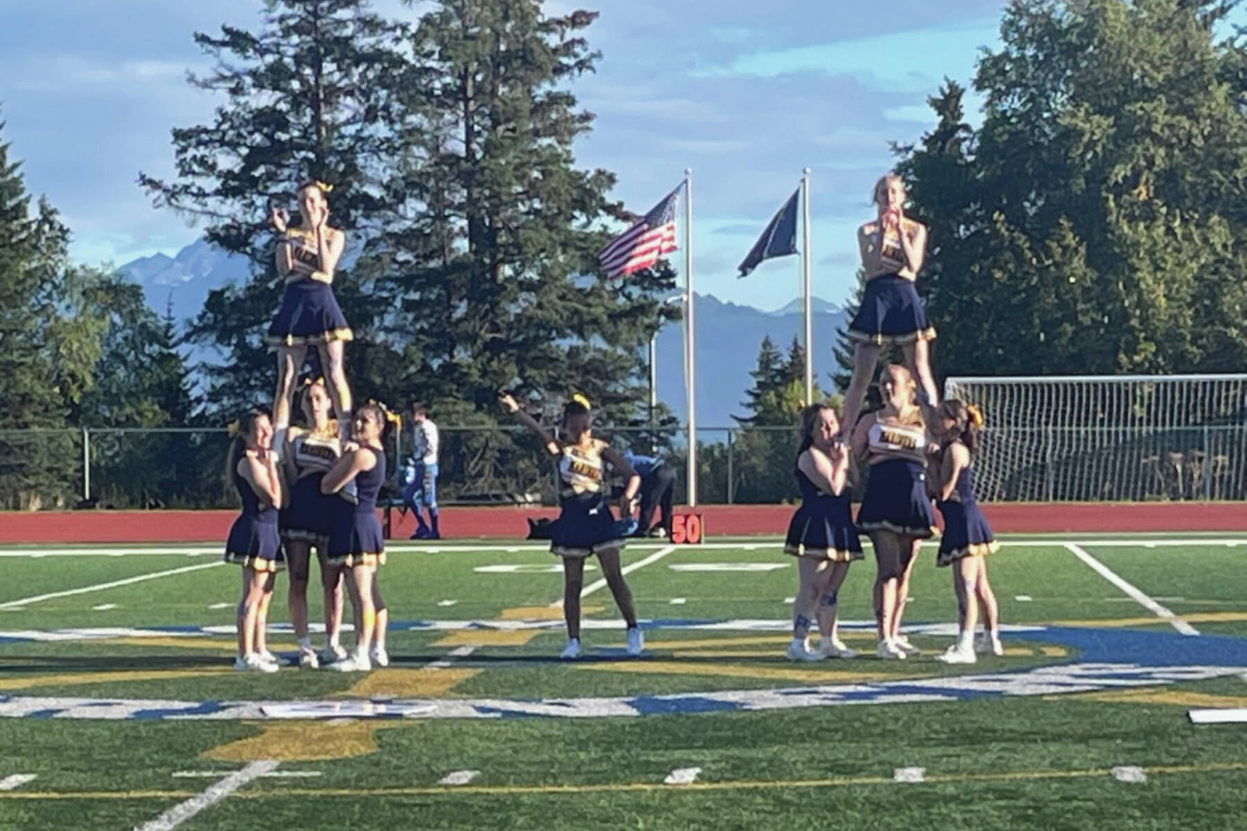 Homer Mariner cheerleaders perform at half time during the game against Kodiak on Friday, Sept. 13, in Homer, Alaska. Varsity defeated Kodiak 58 to 6. (Emilie Springer/ Homer News)