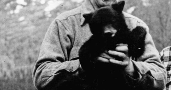 Warren Melville Nutter, seen here holding a black bear cub in an undated photo likely taken in Hope, lived nearly half of his life on the Kenai Peninsula. (Photo courtesy of the Nutter Family Collection)