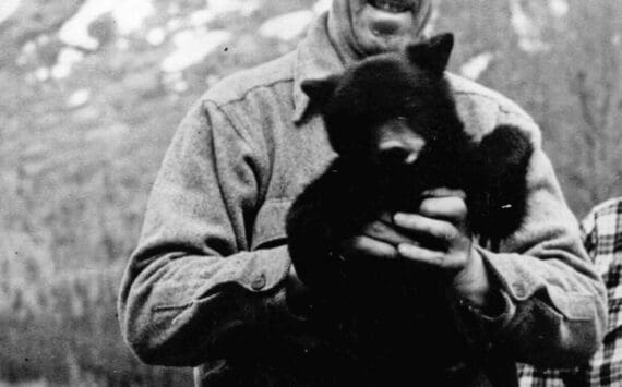 Warren Melville Nutter, seen here holding a black bear cub in an undated photo likely taken in Hope, lived nearly half of his life on the Kenai Peninsula. (Photo courtesy of the Nutter Family Collection)