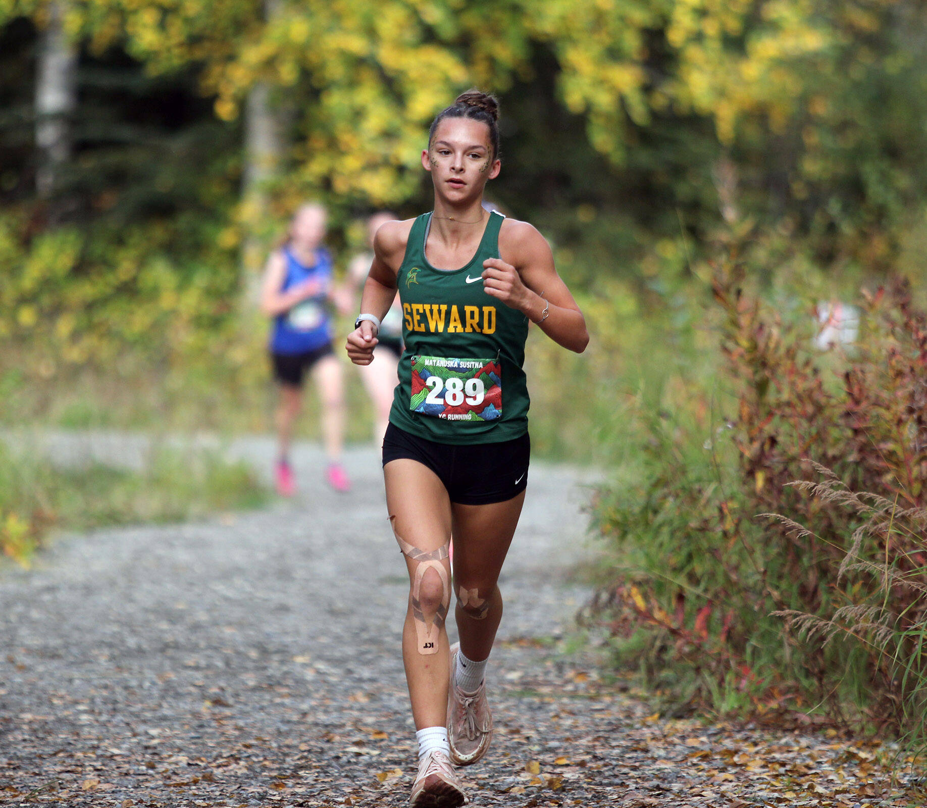 Seward’s Olive Jordan runs the second lap of the girls varsity race during the Wasilla Trailblazer Invite on Friday, Sept. 13, 2024, in Wasilla, Alaska. (Photo by Jeremiah Bartz/Frontiersman)