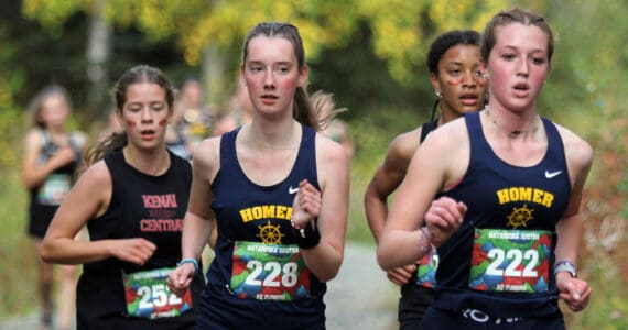 Homer’s Claira Booz, right, and Beatrix McDonough, left, lead a small pack of runners during the Wasilla Trailblazer Invite on Friday, Sept. 13, 2024, in Wasilla, Alaska. (Photo by Jeremiah Bartz/Frontiersman)