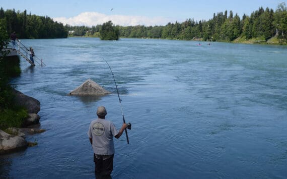 A man fishes in the Kenai River on July 16, 2018, in Soldotna, Alaska. (Peninsula Clarion/file)