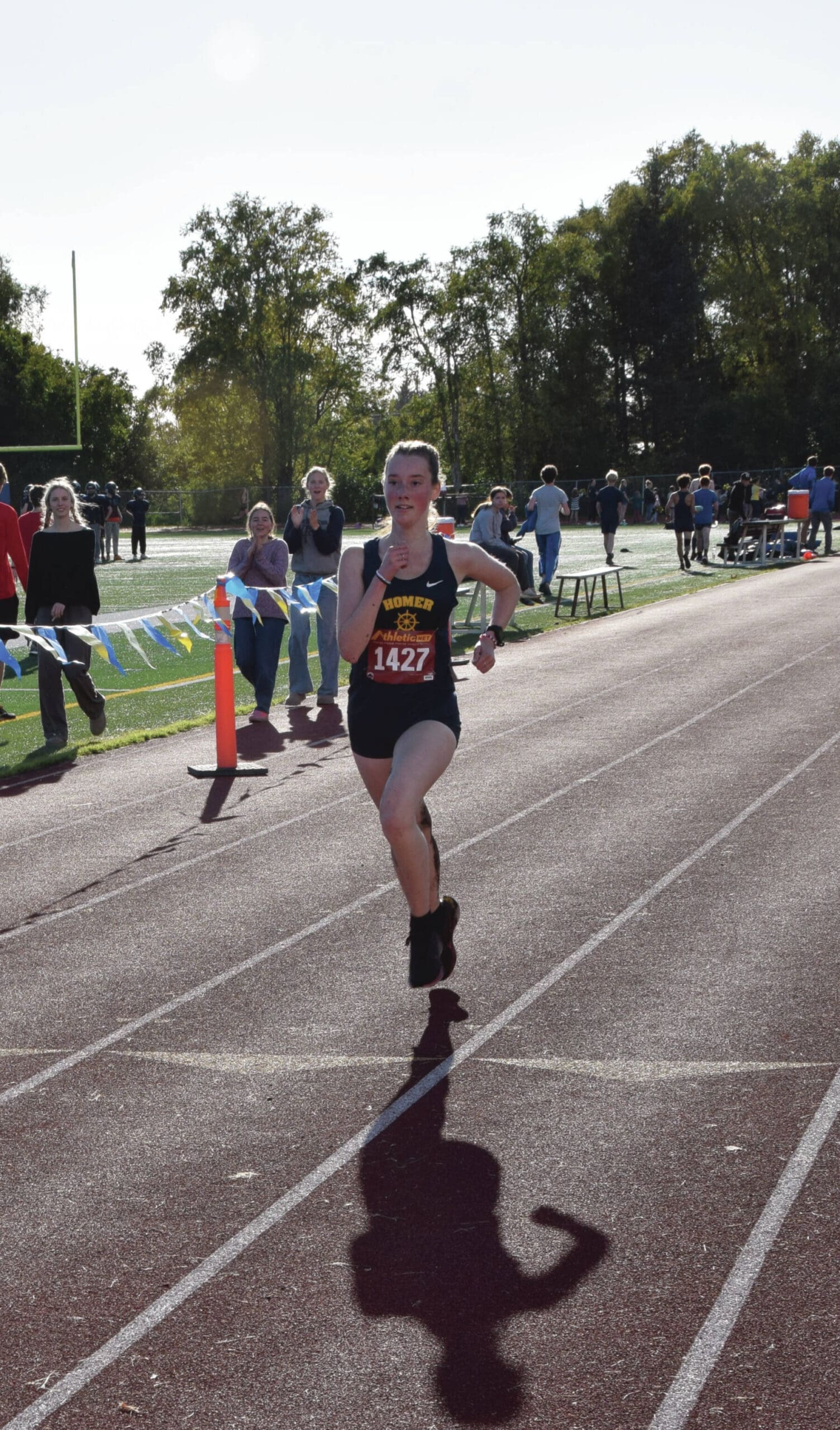 Photo by Emilie Springer/Homer News
Senior varsity runner Bea McDonough approaches the finish line to take second place in the Kenai Peninsula Borough cross country championships in Homer<ins>, Alaska</ins> on Thursday, Sept. 19<ins>,</ins> <ins>2024</ins>.