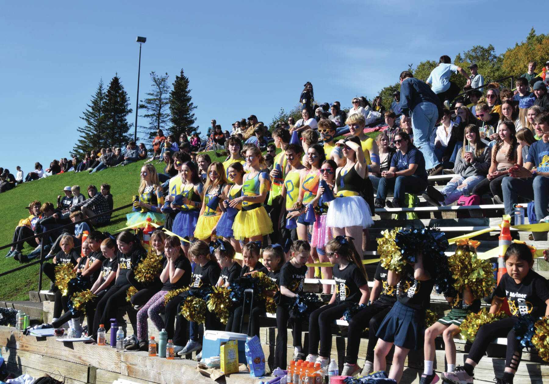 Homer “Bleacher Creatures” and little cheer team root for the Mariners at the Homer homecoming football game on Sept. 21, 2024 in Homer, Alaska. Emilie Springer/ Homer News.
Emilie Springer/ Homer News
Homer “Bleacher Creatures” and little cheer team root for the Mariners at the Homer homecoming football game on Saturday.