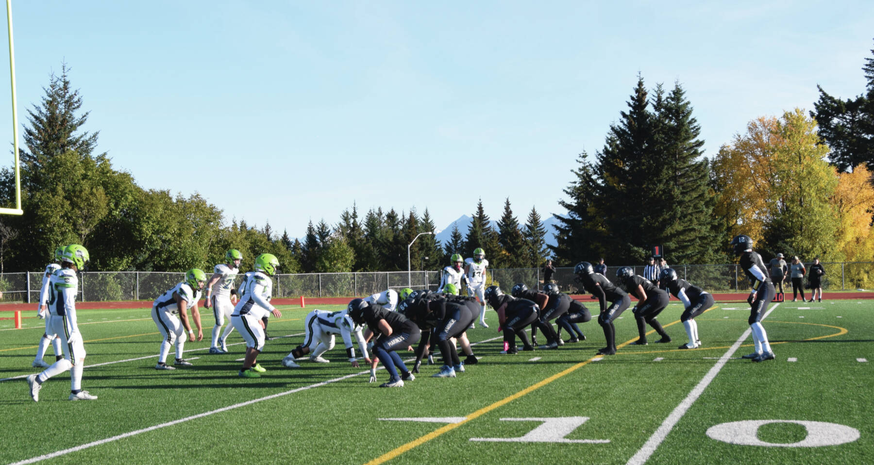 Emilie Springer/Homer News
The Homer varsity Mariners get ready against Redington at the line of scrimmage during the first quarter of the home game on Friday, Sept. 27<ins>, 2024,</ins> at the Homer High School football field<ins> in Homer, Alaska</ins>.