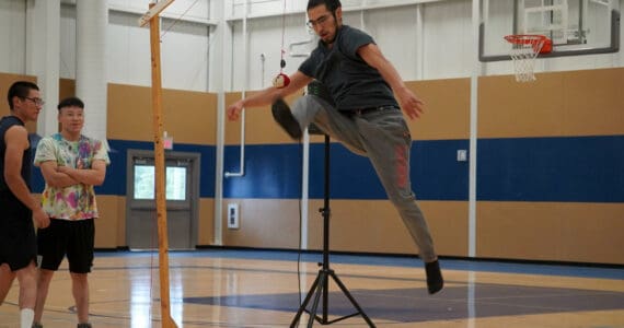 Alaska Christian College students perform a demonstration of Native Youth Olympics during a dedication ceremony for the college’s new athletic center at Alaska Christian College in Soldotna, Alaska, on Friday, Sept. 27, 2024. (Jake Dye/Peninsula Clarion)