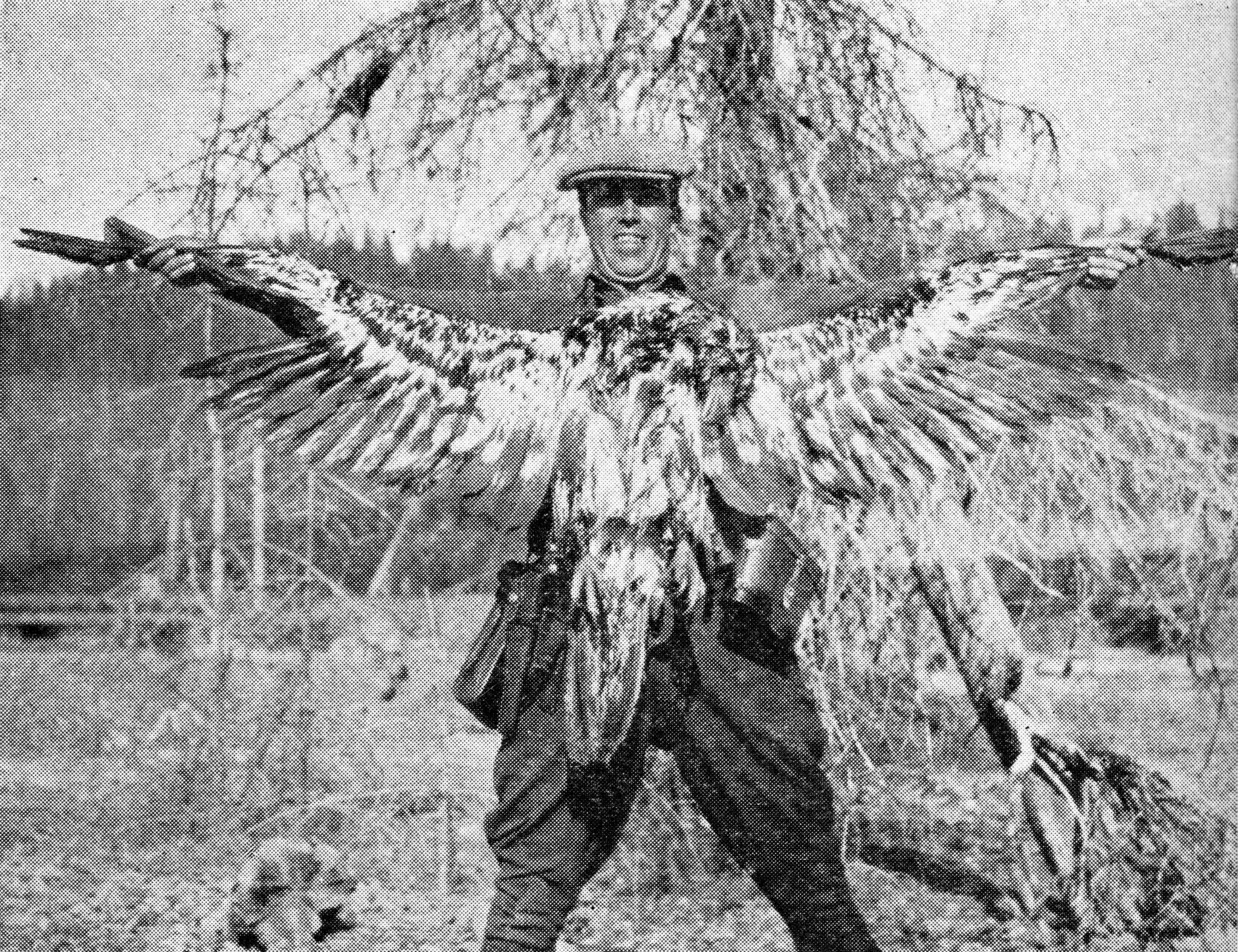 This photo of Warren Melville Nutter, holding a dead juvenile bald eagle that he shot for the bounty, appeared in the May 1938 edition of The Alaska Sportsman Magazine. The photo was probably taken near the mouth of Hidden Creek on Skilak Lake.