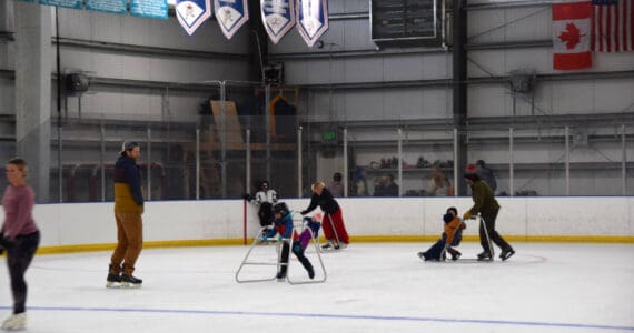 Young and experienced skaters alike enjoy the ice at the Kevin Bell Arena during opening day on Saturday, Oct. 5, 2024, in Homer, Alaska. In addition to a free open skate, the arena also hosted a hockey gear swap and stick time, and a free barbecue lunch for attending community members. Attendees were also encouraged to register for a variety of upcoming skating programs, including youth and adult hockey, figure skating and learn-to-skate classes. (Delcenia Cosman/Homer News)