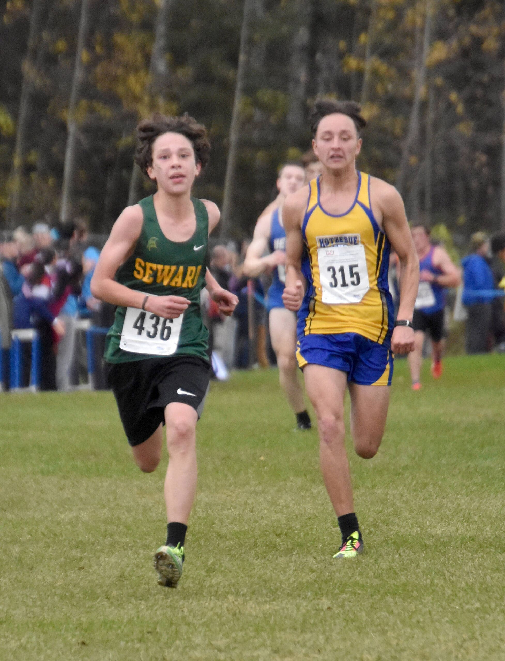 Seward’s Antrim Sampson and Kotzebue’s Ben Marcus compete in the Division II boys race at the state cross-country running meet on Saturday, Oct. 5, 2024, at Bartlett High School in Anchorage, Alaska. (Photo by Jeff Helminiak/Peninsula Clarion)