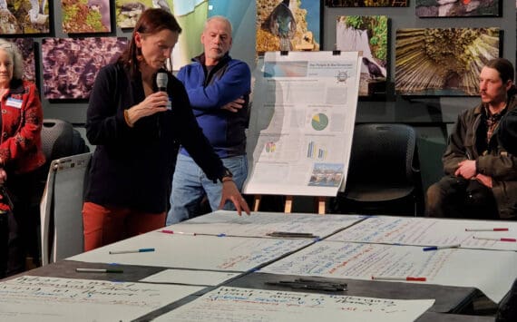 Agnew::Beck project consultant Shelly Wade explains the public feedback process at the Comprehensive Plan Open House on Thursday, March 28, 2024 at the Alaska Maritime National Wildlife Refuge Visitor Center auditorium in Homer, Alaska. (Delcenia Cosman/Homer News)