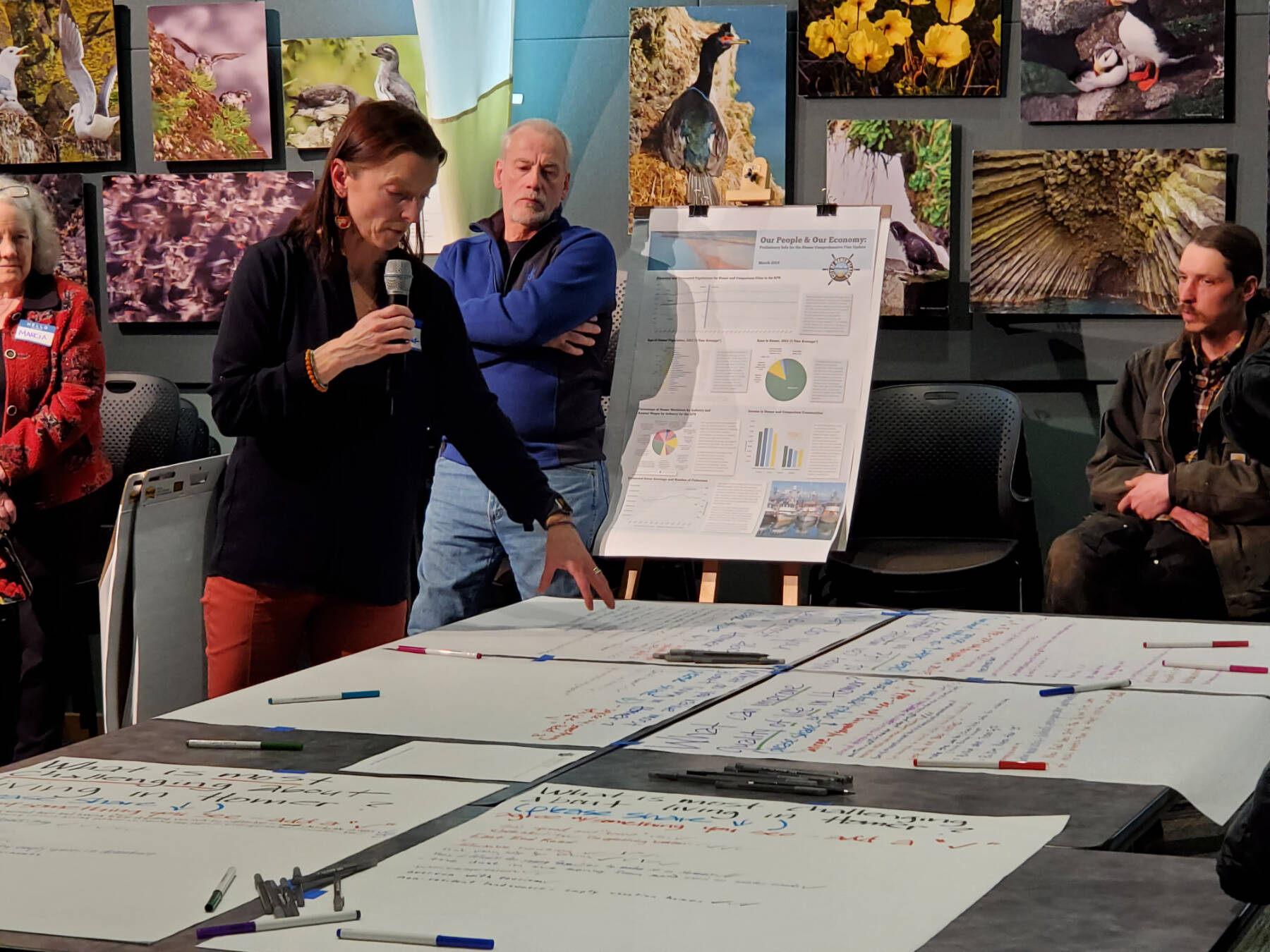 Agnew::Beck project consultant Shelly Wade explains the public feedback process at the Comprehensive Plan Open House on Thursday, March 28, 2024 at the Alaska Maritime National Wildlife Refuge Visitor Center auditorium in Homer, Alaska. (Delcenia Cosman/Homer News)