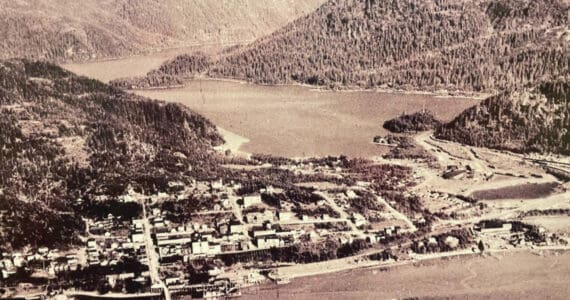 An aerial view of old town Cordova is displayed on the wall of the Pioneers of Alaska Igloo No. 19, established in 1918, during a tour of the Igloo at the Alaska Historical Society Conference in October 2024.  (Emilie Springer/Homer News)