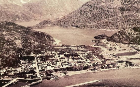 An aerial view of old town Cordova is displayed on the wall of the Pioneers of Alaska Igloo No. 19, established in 1918, during a tour of the Igloo at the Alaska Historical Society Conference in October 2024.  (Emilie Springer/Homer News)