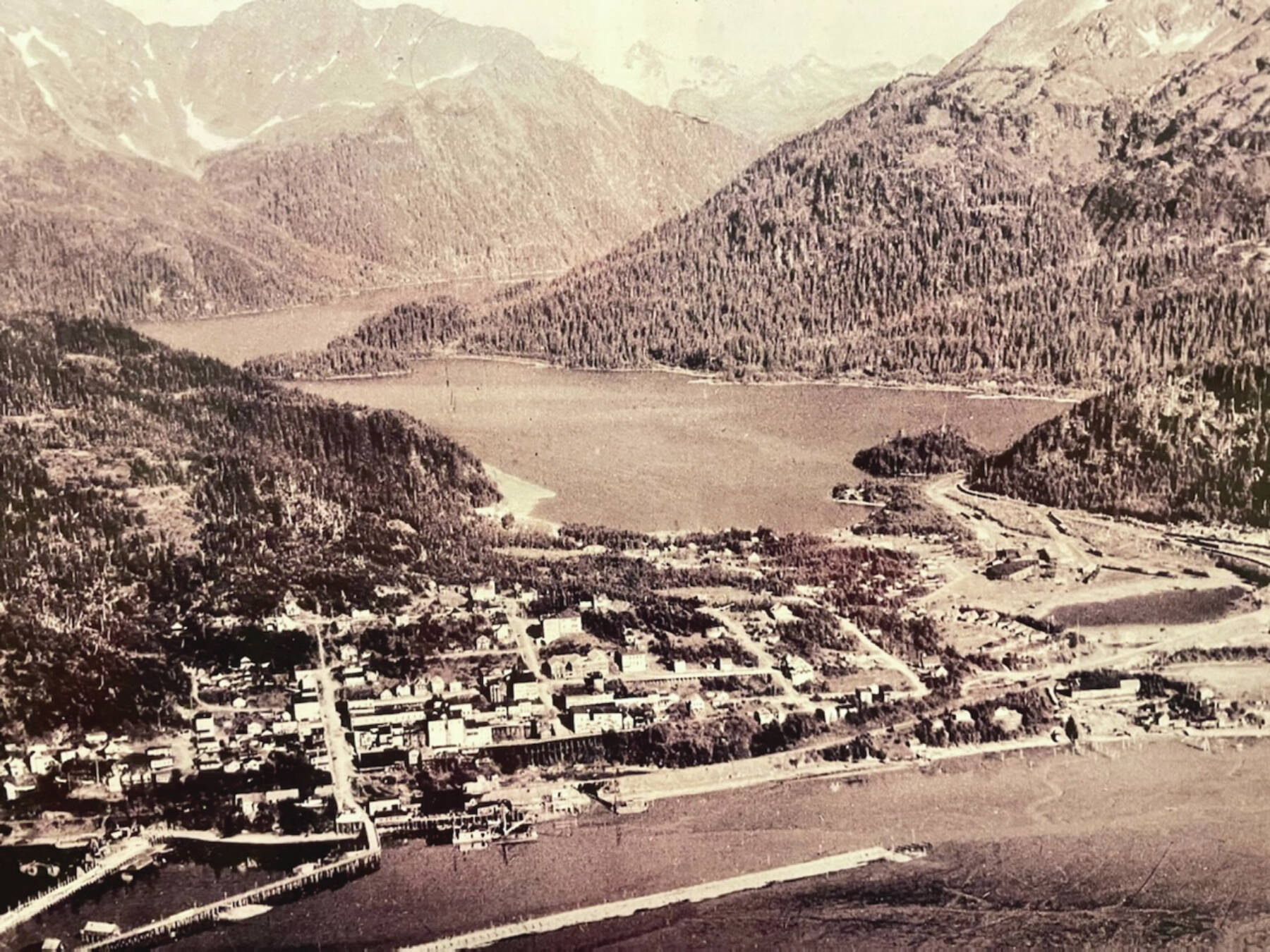 An aerial view of old town Cordova is displayed on the wall of the Pioneers of Alaska Igloo No. 19, established in 1918, during a tour of the Igloo at the Alaska Historical Society Conference in October 2024. (Emilie Springer/Homer News)