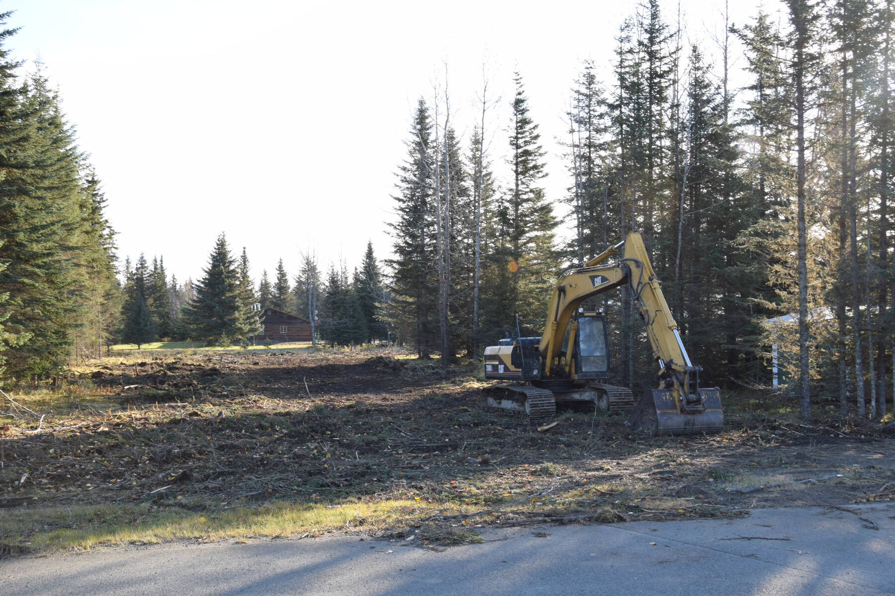 Heavy equipment is parked on the cleared lot adjacent to the Anchor Point Community and Senior Center on Monday, Oct. 14, 2024, in Anchor Point, Alaska. (Delcenia Cosman/Homer News)