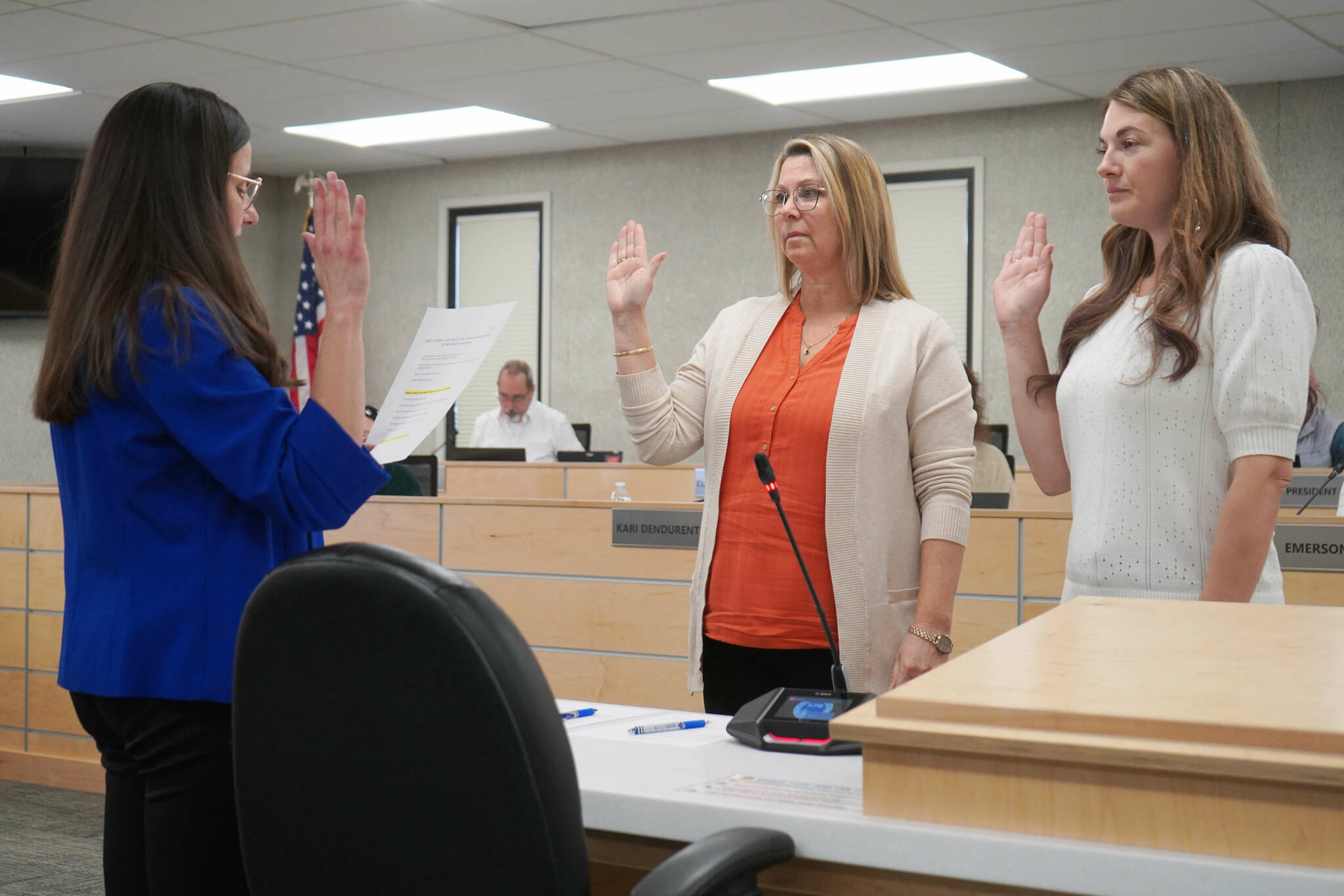 Jake Dye/Peninsula Clarion
Administrative Secretary Nikkol Sipes administers oaths of office to Kenai Peninsula Borough School District Board of Education members Kelley Cizek and Sarah Douthit on Monday, Oct. 14, 2024. Cizek was reelected to represent Sterling and Funny River, Douthit was elected to represent Kenai during the Oct. 1 municipal election.