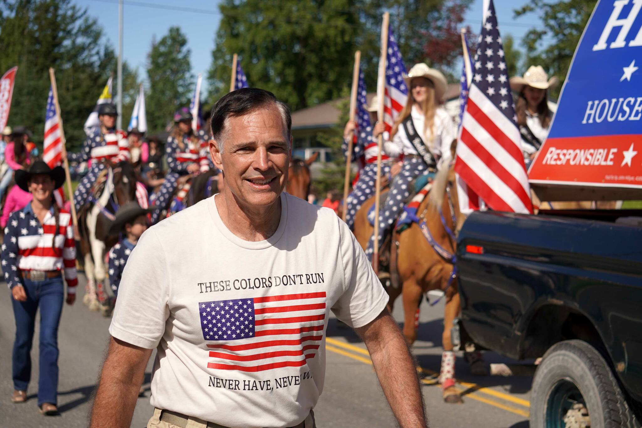 John Hillyer, candidate for the Alaska House of Representatives, walks with the 67th Annual Soldotna Progress Days Parade on Marydale Avenue in Soldotna, Alaska, on Saturday, July 27, 2024. (Jake Dye/Peninsula Clarion)