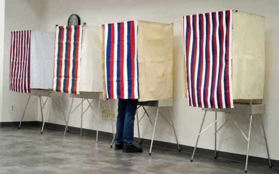 A voter fills out their ballot at the Kenai No. 2 Precinct in the Challenger Learning Center of Alaska in Kenai, Alaska, on Tuesday, Oct. 1, 2024. (Jake Dye/Peninsula Clarion)