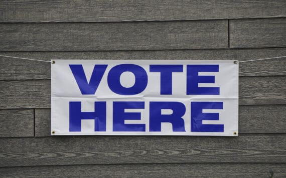 A banner at Homer City Hall identifies the building as a voting precinct. Early voting runs at city hall from 9 a.m. to 4 p.m. through Nov. 4 in Homer, Alaska. (Photo by Michael Armstrong/Homer News)