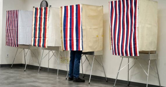 A voter fills out their ballot at the Kenai No. 2 Precinct in the Challenger Learning Center of Alaska in Kenai, Alaska, on Tuesday, Oct. 1, 2024. (Jake Dye/Peninsula Clarion)