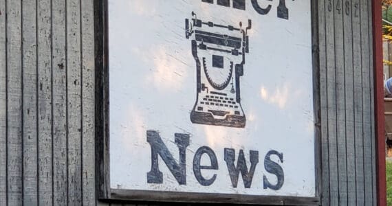 The Homer News sign hangs on the outside of the newspaper’s former office building on Landings Street on Thursday, Oct. 17, 2024, in Homer, Alaska. (Delcenia Cosman/Homer News)