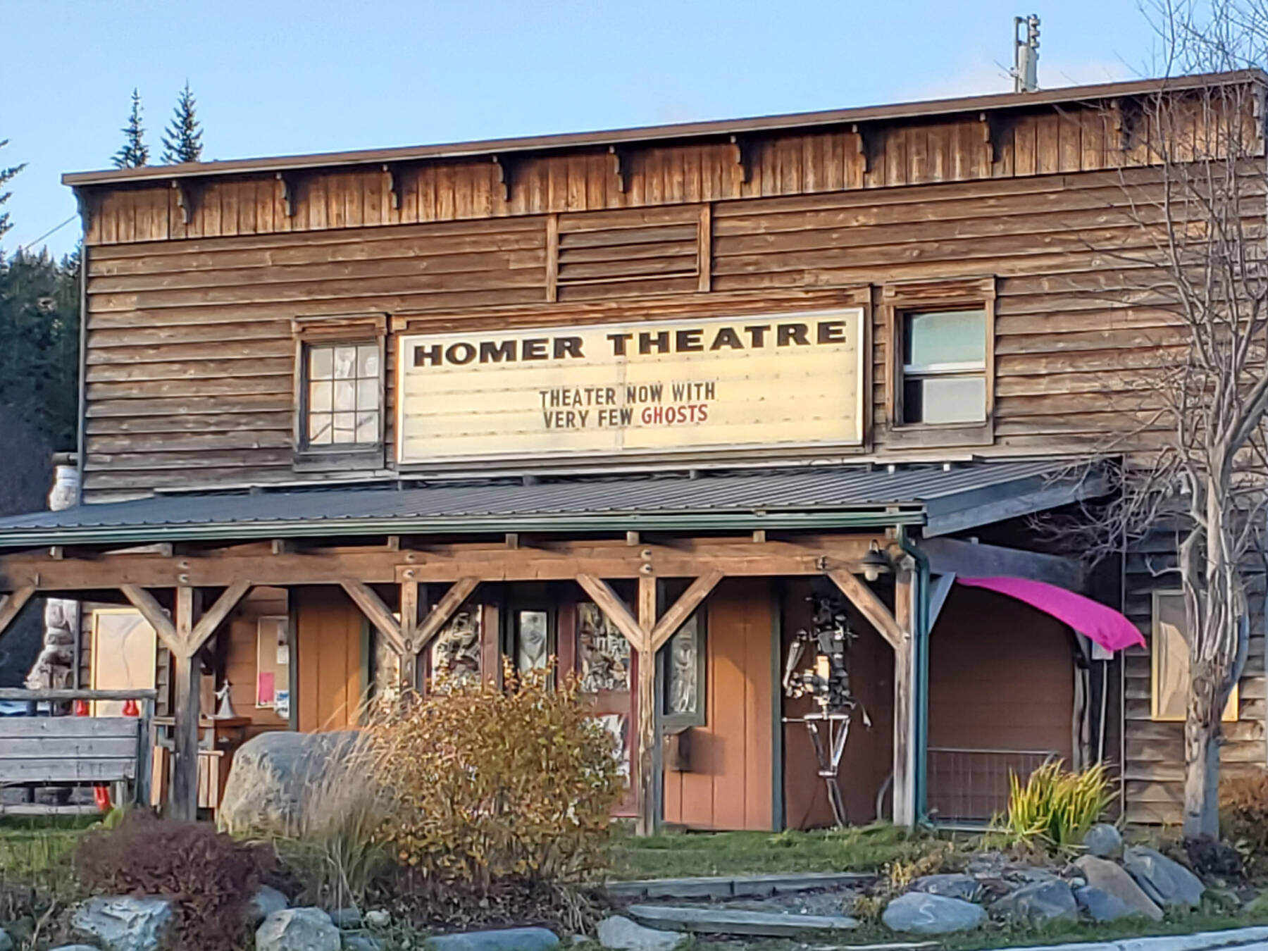 The marquee at the former Homer Theatre, soon to be the Porcupine Theatre, reads “Theater now with very few ghosts” on Tuesday, Oct. 22, 2024, in Homer, Alaska. (Delcenia Cosman/Homer News)