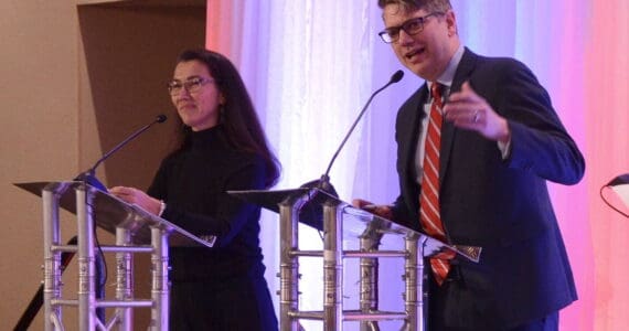 Republican U.S. House candidate Nick Begich speaks to an audience at the Alaska Chamber of Commerce’s U.S. House debate on Thursday, Oct. 10, 2024, in Fairbanks. At left is incumbent Rep. Mary Peltola, D-Alaska. (James Brooks/Alaska Beacon)