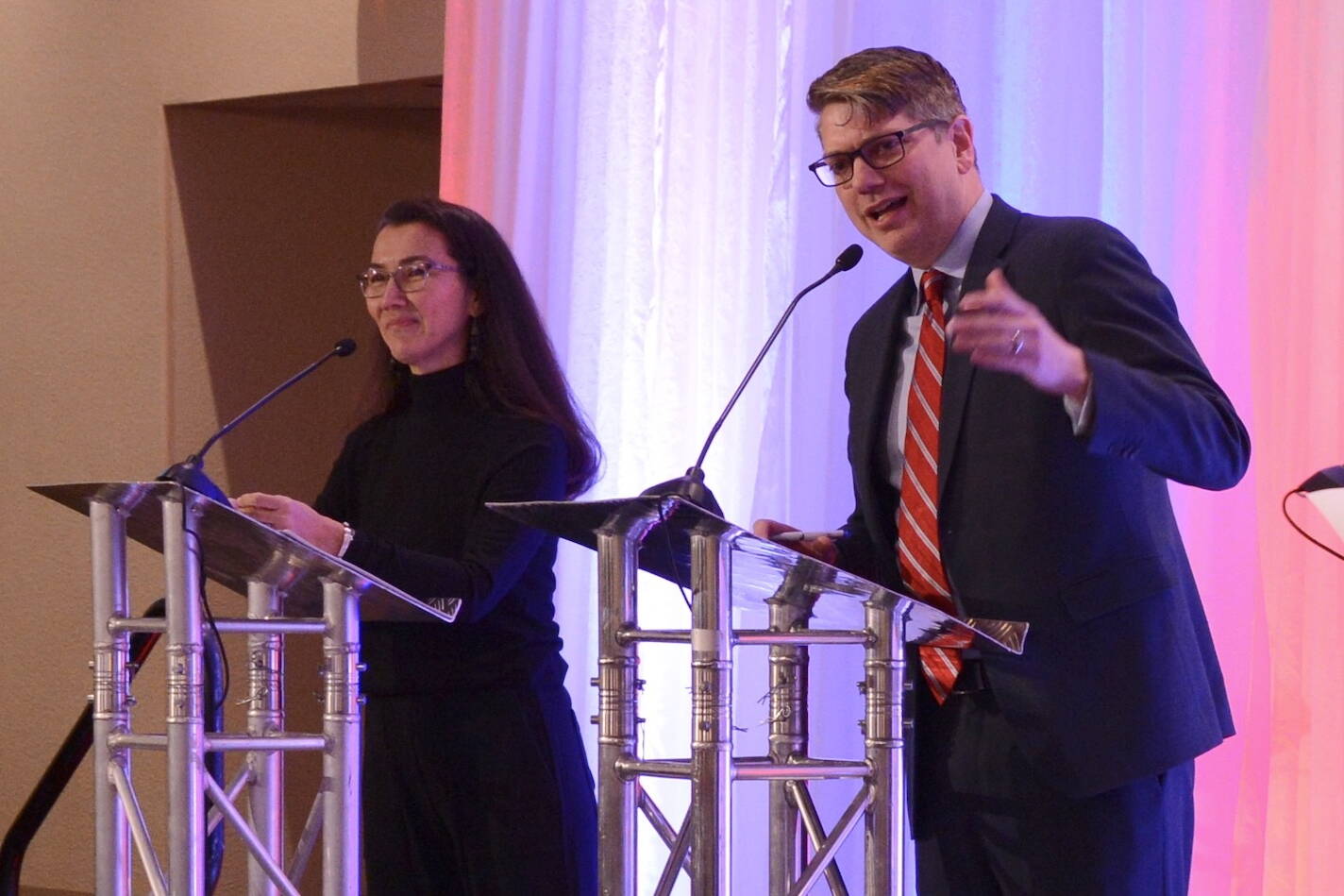 Republican U.S. House candidate Nick Begich speaks to an audience at the Alaska Chamber of Commerce’s U.S. House debate on Thursday, Oct. 10, 2024, in Fairbanks. At left is incumbent Rep. Mary Peltola, D-Alaska. (James Brooks/Alaska Beacon)