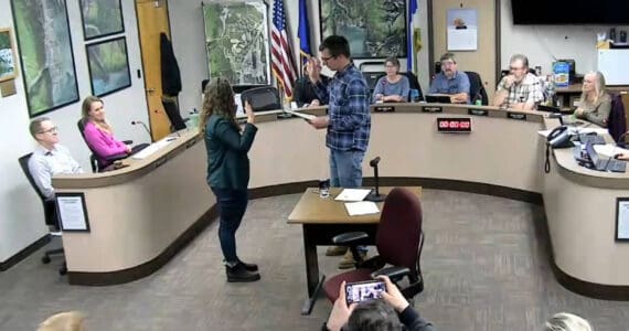 Seward City Clerk Kris Peck, right, administers an oath of office to Seward City Council newcomer Casie Warner during a council meeting in Seward, Alaska, on Oct. 28, 2024. (Screenshot courtesy City of Seward)