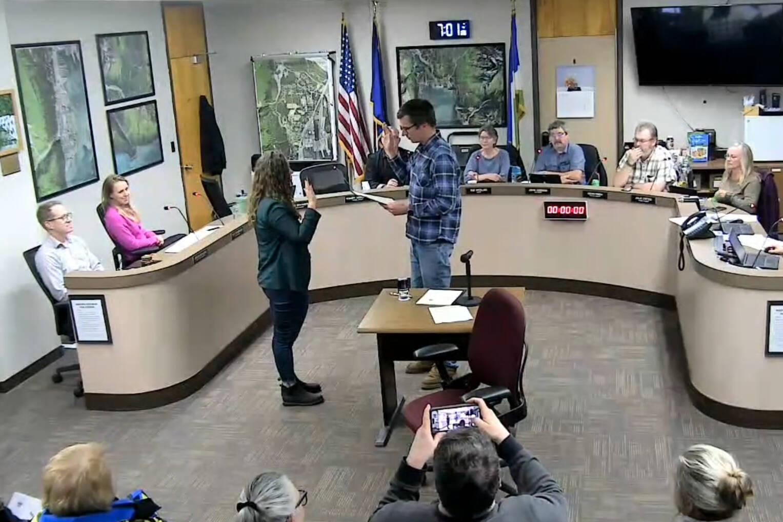 Seward City Clerk Kris Peck, right, administers an oath of office to Seward City Council newcomer Casie Warner during a council meeting in Seward, Alaska, on Oct. 28, 2024. (Screenshot courtesy City of Seward)