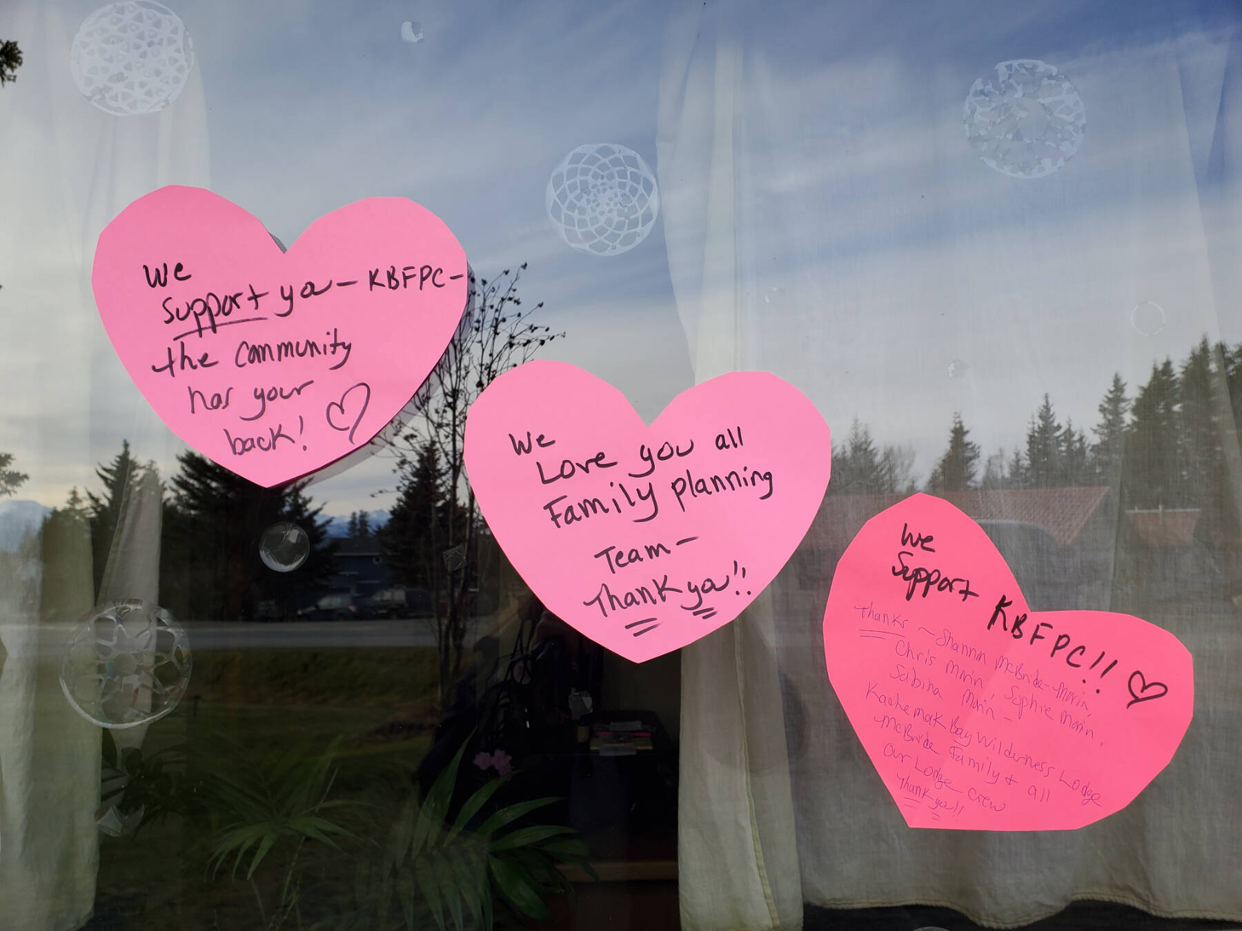 Letters of support are posted to the window of the Kachemak Bay Family Planning Clinic on Tuesday, Nov. 12, 2024, following a shooting incident on Monday, Nov. 11 at 5:45 a.m. in Homer, Alaska. (Delcenia Cosman/Homer News)