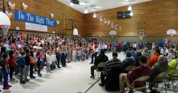 Students sing “My Country, ‘Tis of Thee” at Mountain View Elementary in Kenai, Alaska, during a celebration of Veterans Day on Monday, Nov. 11, 2024. (Jake Dye/Peninsula Clarion)