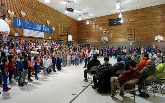 Students sing “My Country, ‘Tis of Thee” at Mountain View Elementary in Kenai, Alaska, during a celebration of Veterans Day on Monday, Nov. 11, 2024. (Jake Dye/Peninsula Clarion)