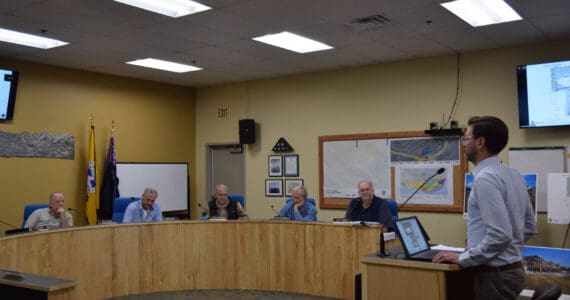 Doyon representative Zach Dunlap (right) presents the revised application for the Lighthouse Village redevelopment during a special Planning Commission meeting on Wednesday, Oct. 16, 2024, in the Homer City Hall Cowles Council Chambers in Homer, Alaska. (Delcenia Cosman/Homer News)