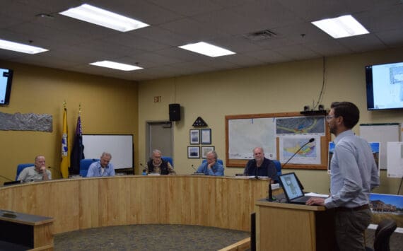 Doyon representative Zach Dunlap (right) presents the revised application for the Lighthouse Village redevelopment during a special Planning Commission meeting on Wednesday, Oct. 16, 2024, in the Homer City Hall Cowles Council Chambers in Homer, Alaska. (Delcenia Cosman/Homer News)