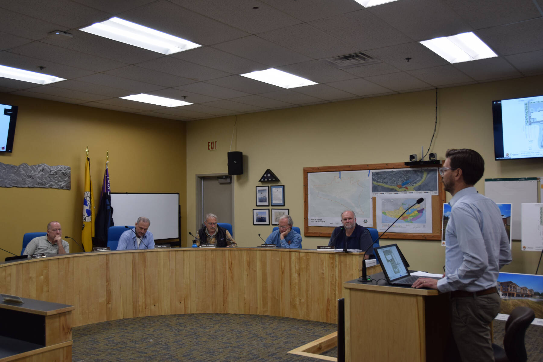 Doyon representative Zach Dunlap (right) presents the revised application for the Lighthouse Village redevelopment during a special Planning Commission meeting on Wednesday, Oct. 16, 2024, in the Homer City Hall Cowles Council Chambers in Homer, Alaska. (Delcenia Cosman/Homer News)