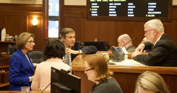 State Senate Majority Leader Cathy Giessel, R-Anchorage, left, confers with Senate President Gary Stevens, R-Kodiak, and other members during an April 24, 2024 floor session. (Mark Sabbatini / Juneau Empire file photo)