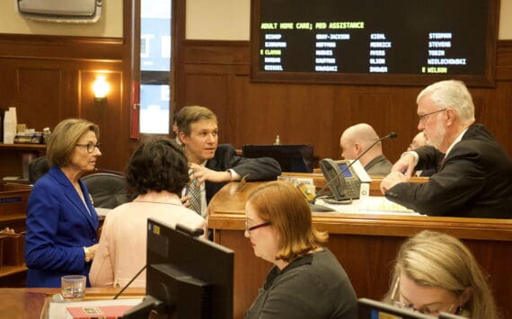 State Senate Majority Leader Cathy Giessel, R-Anchorage, left, confers with Senate President Gary Stevens, R-Kodiak, and other members during an April 24, 2024 floor session. (Mark Sabbatini / Juneau Empire file photo)