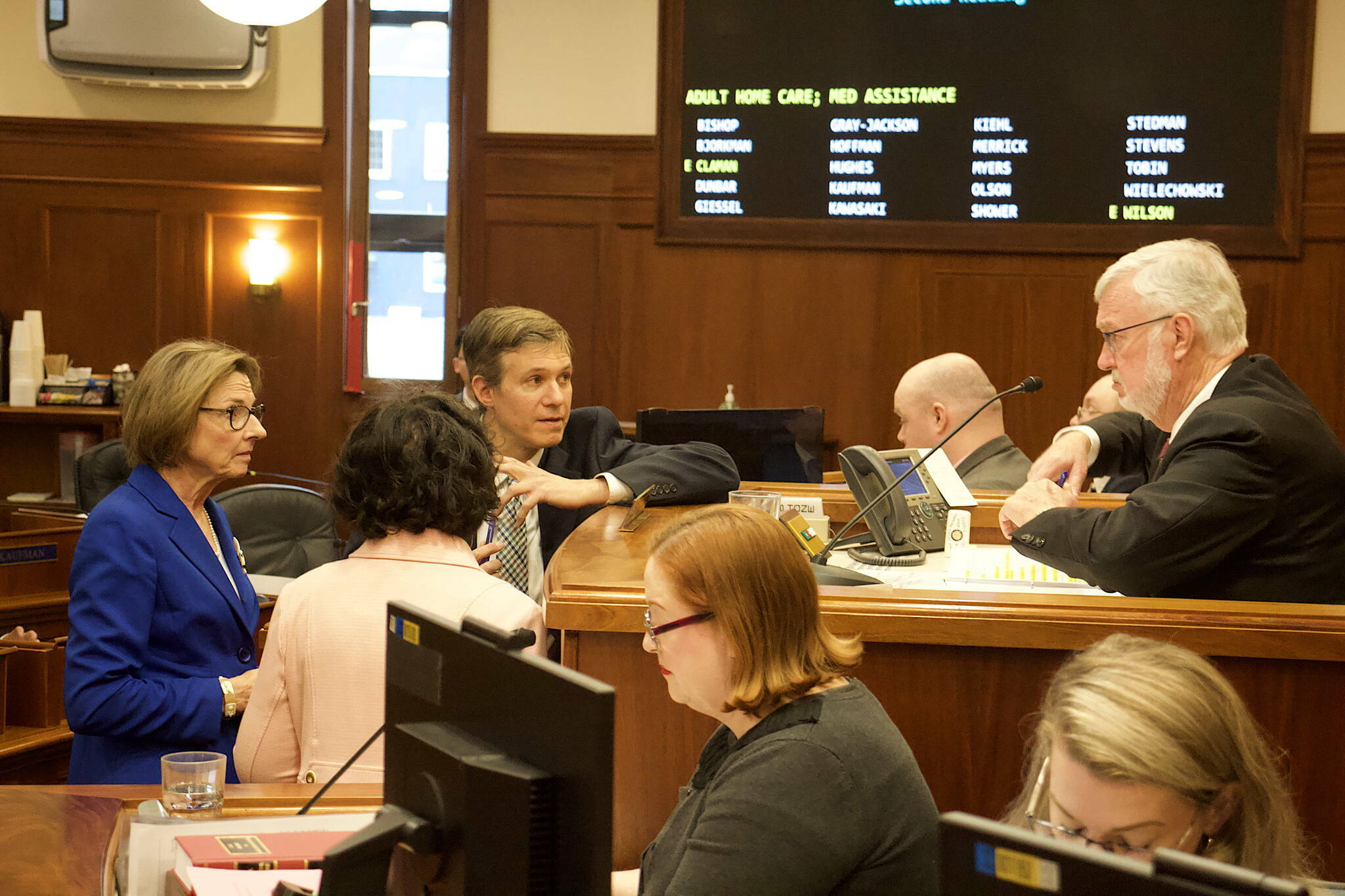 State Senate Majority Leader Cathy Giessel, R-Anchorage, left, confers with Senate President Gary Stevens, R-Kodiak, and other members during an April 24, 2024 floor session. (Mark Sabbatini / Juneau Empire file photo)