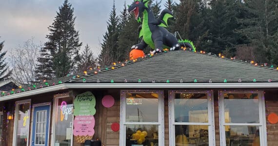 An inflatable dragon guards the rooftop of Bubbles Soda Parlor on Monday, Nov. 11, 2024, in Homer, Alaska. (Delcenia Cosman/Homer News)