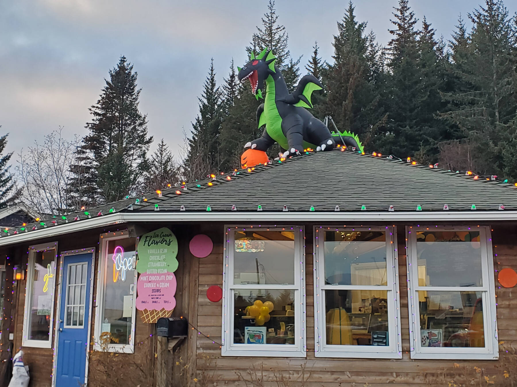 An inflatable dragon guards the rooftop of Bubbles Soda Parlor on Monday, Nov. 11, 2024, in Homer, Alaska. (Delcenia Cosman/Homer News)