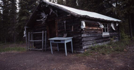 This is the cabin on Pipe Creek, along the north shore of Tustumena Lake, where Harold Galliett sought shelter after surviving a commercial airlines crash in the lake in September 1965. (Photo by Clark Fair, 1990)