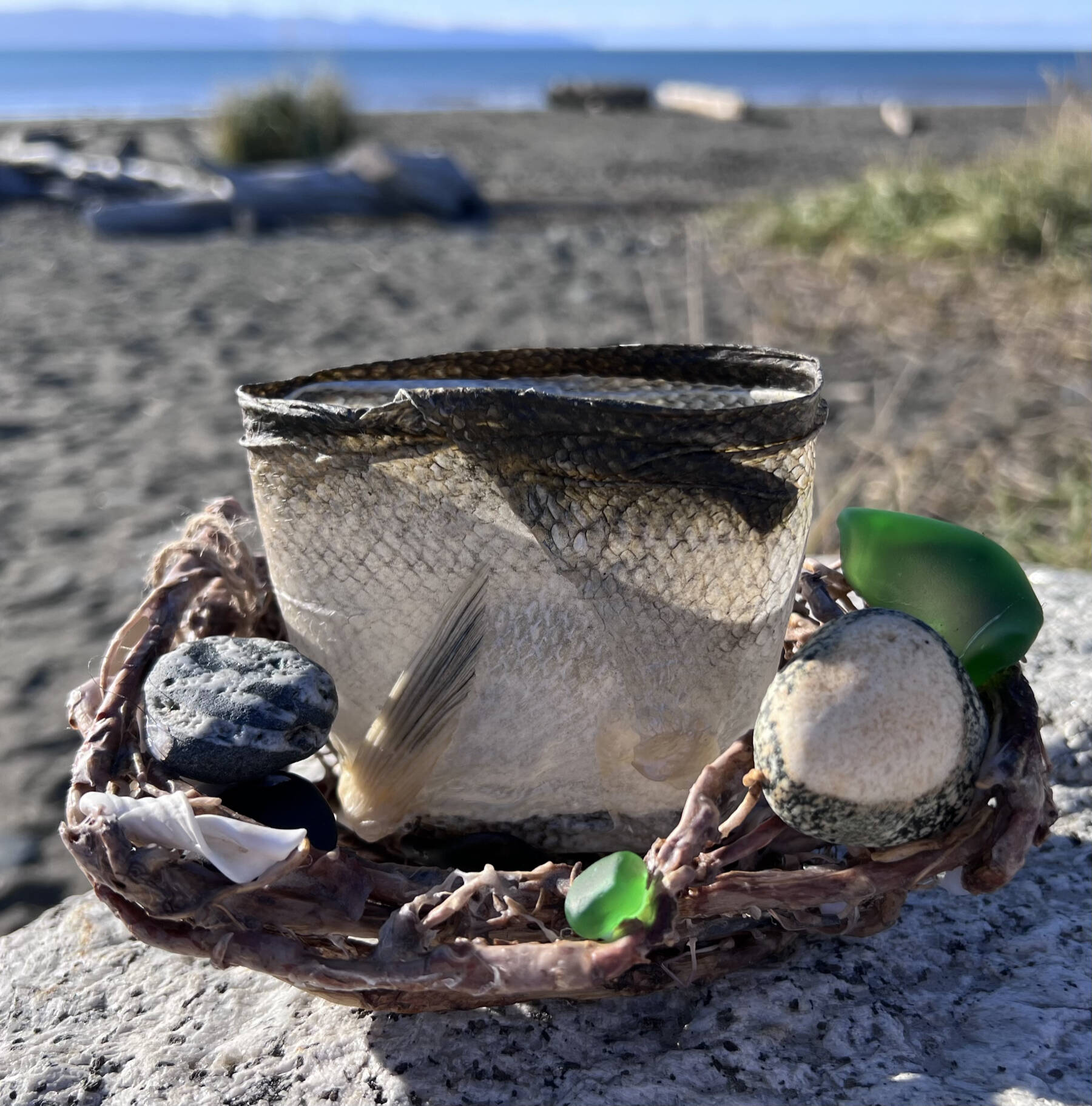 “Jumper,” a basket created by Michelle Anderson out of sockeye salmon skin, fireweed roots and other beach treasures, is one of several baskets available at Ptarmigan Arts. Photo provided by Michelle Anderson