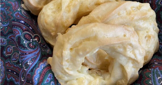 These light and savory cheesy ring puff snacks are piped pate a choux with a generous handful of shredded edam cheese. (Photo by Tressa Dale/Peninsula Clarion)