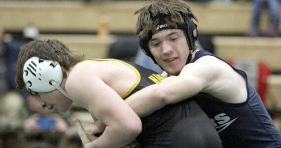 Soldotna’s Carson Cobb maintains a hold of Jett Connolly of the Student Wrestling Development Program during the 130-pound final of the Colony Invitational on Saturday, Nov. 23, 2024, at Colony High School in Palmer. (Photo by Jeremiah Bartz/Frontiersman)