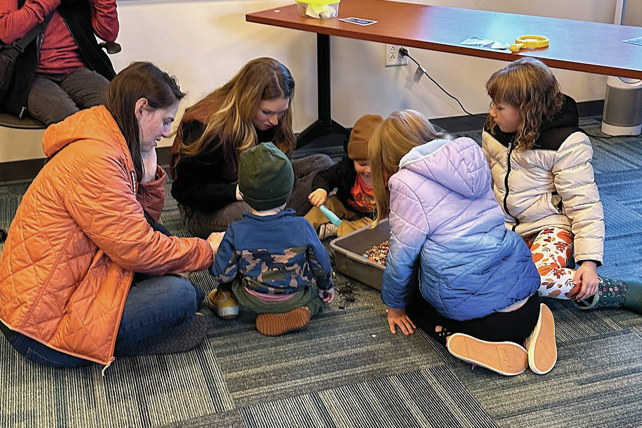 Families enjoyed exploring the sensory spider bin. (Photo courtesy Kenai National Wildlife Refuge)