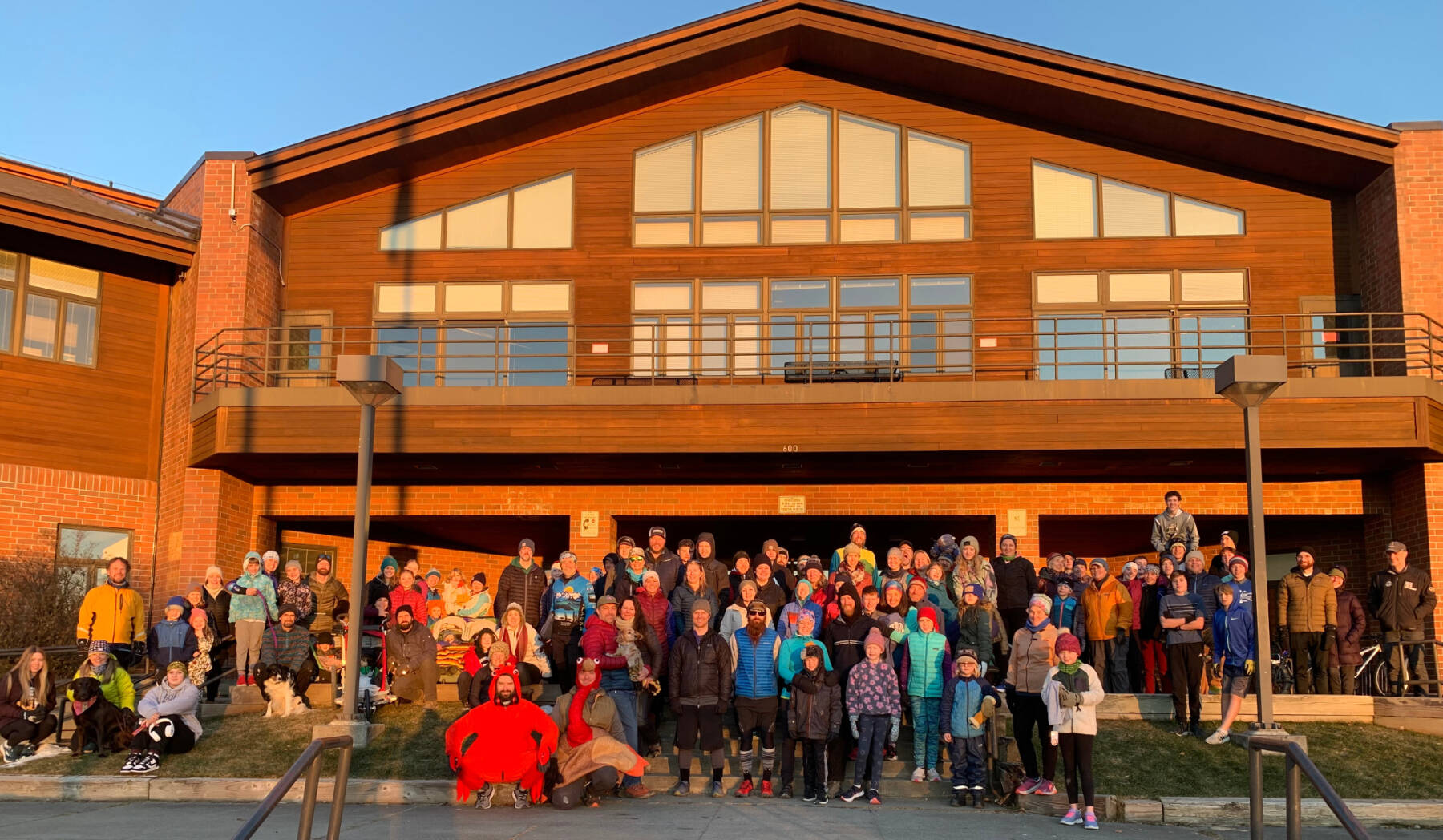 Turkey Trot participants gather for a photo in front of Homer High School, which served as the race’s starting and finish line, on Thursday, Nov. 28, 2024, in Homer, Alaska. More than 120 community members participated in the race, which was co-sponsored by the Kachemak Bay Running Club, and over 300 non-perishable food items were donated to the Homer Food Pantry after the event. Photo courtesy of Matt Smith