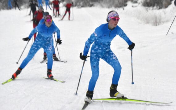 Soldotna’s Tania Boonstra leads Soldotna’s Ariana Cannava and the rest of the pack at the girls varsity race of the Turkey Skate on Tuesday, Nov. 26, 2024, at Tsalteshi Trails just outside of Soldotna, Alaska. (Photo by Jeff Helminiak/Peninsula Clarion)