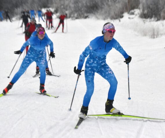 Soldotna’s Tania Boonstra leads Soldotna’s Ariana Cannava and the rest of the pack at the girls varsity race of the Turkey Skate on Tuesday, Nov. 26, 2024, at Tsalteshi Trails just outside of Soldotna, Alaska. (Photo by Jeff Helminiak/Peninsula Clarion)